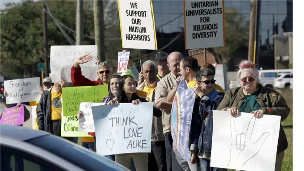 Texans show support for Muslim members of the community near the Clear Lake Islamic Center in Webster, Texas