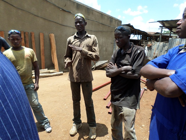 One of Ntamugabumwe employees speaking to USAID Officials