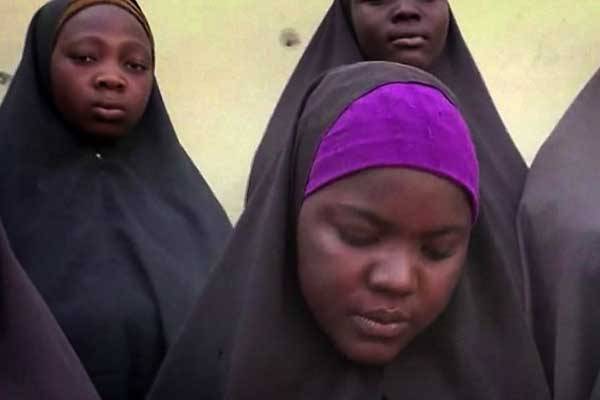 This video grab made on April 14, 2016 from a video obtained via a CNN footage shows 15 of the more than 200 schoolgirls abducted by Boko Haram. Amnesty International has urged Nigeria to shut down a military detention facility for Boko Haram suspects.