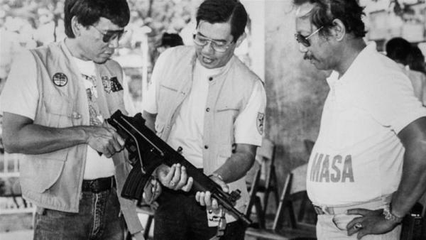 Duterte (L), Davao city mayor in the 1980s, has claimed to have killed people