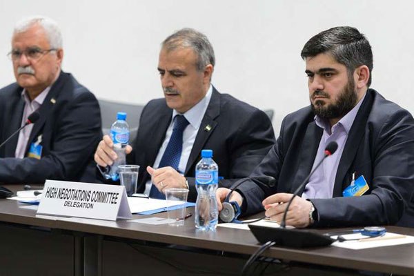 Syrian opposition body (HCN) delegation (from left) George Sabra, delegation head Asaad al-Zoabi and Chief negotiator, Army of Islam rebel group's Mohammed Alloush attend a meeting on Syria peace talks with UN Syria envoy at the United Nations Office on April 15, 2016 in Geneva.