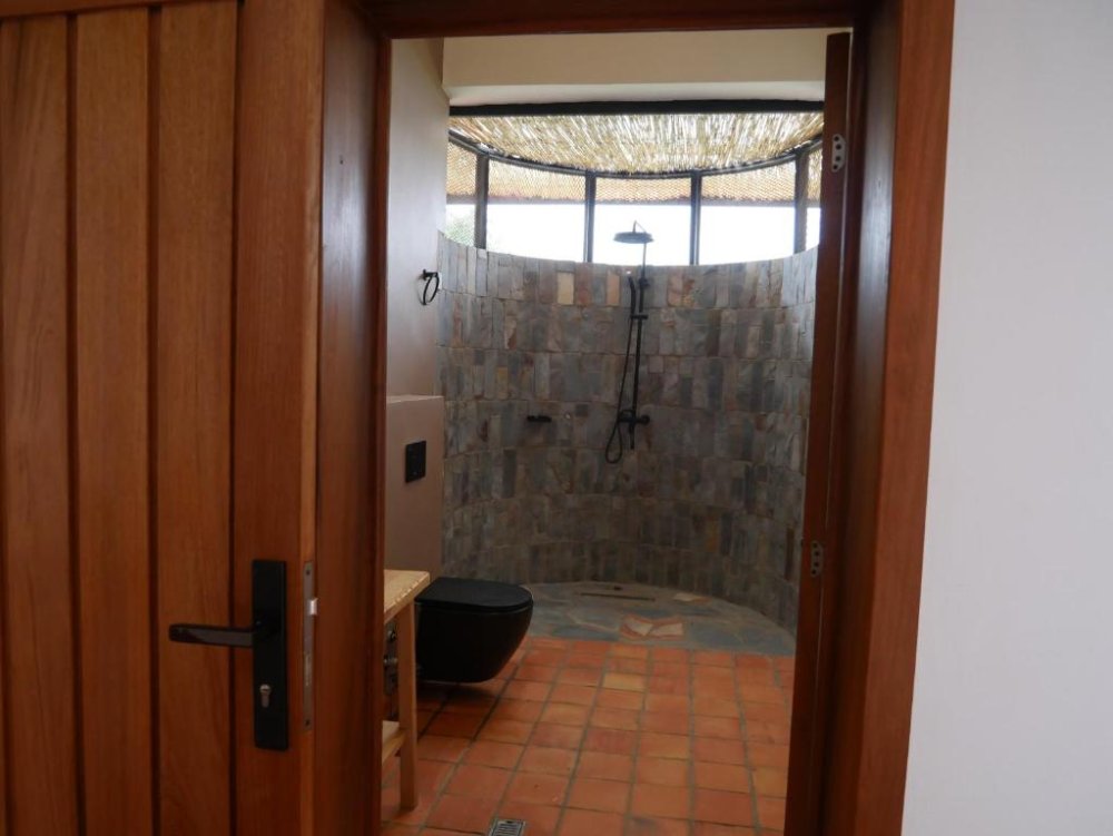 The hotel’s bathrooms have unique features, allowing guests to shower while enjoying the fresh breeze from outside.