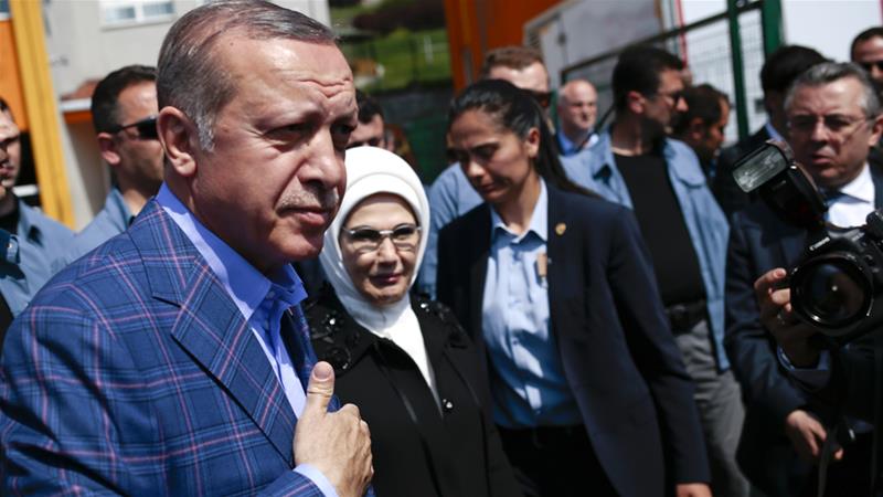 President Erdogan and his wife Emine leave a polling station in Istanbul on Sunday