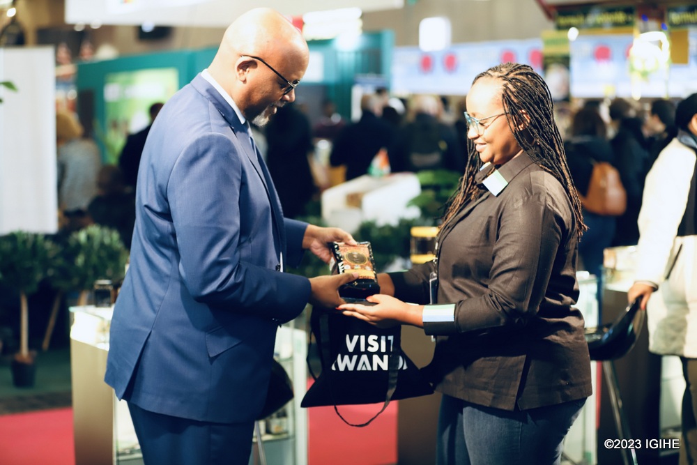 Nadège Uwamahoro showing her products to Amb. Nkurikiyinka. 