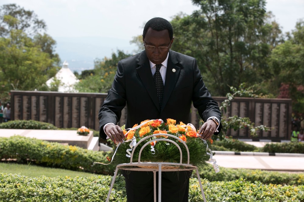 Senate President Bernard Makuza laying a wreath on the graves of the victims at Rebero genocide memorial.