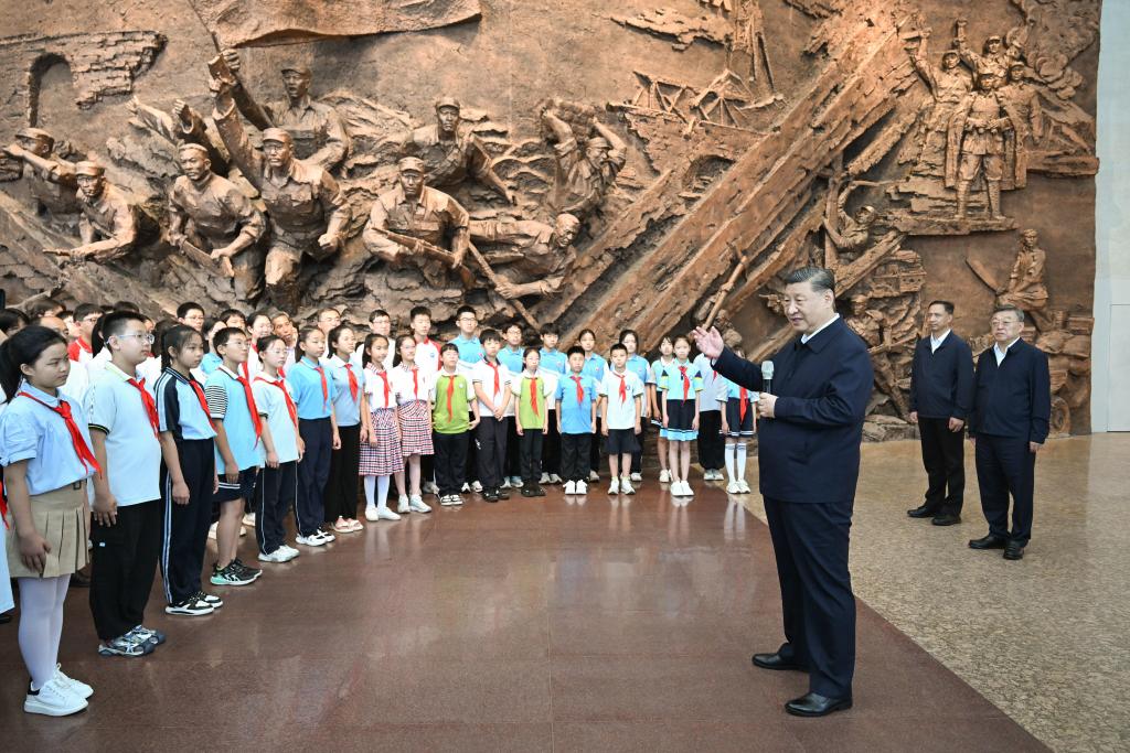 Chinese President Xi Jinping, also general secretary of the Communist Party of China Central Committee and chairman of the Central Military Commission, talks with students and staff members at the memorial hall commemorating the Hundred-Regiment Campaign during the war of resistance against Japanese aggression, when inspecting Yangquan City, north China's Shanxi Province, July 7, 2025. (Xinhua/Xie Huanchi)