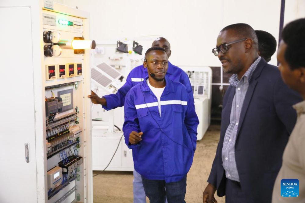 An instructor introduces the electrical control cabinet at the Chinese-built Forever TVET Institute in Kigali, Rwanda, on July 8, 2025. (Photo by Huang Wanqing/Xinhua)