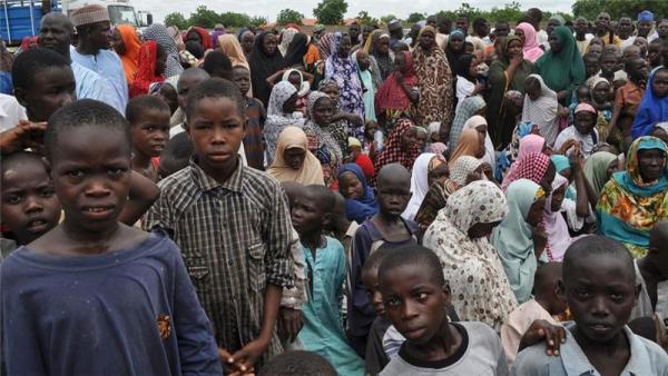 Civilians take refuge at a school in Maiduguri after fleeing Boko Haram attack in Bama