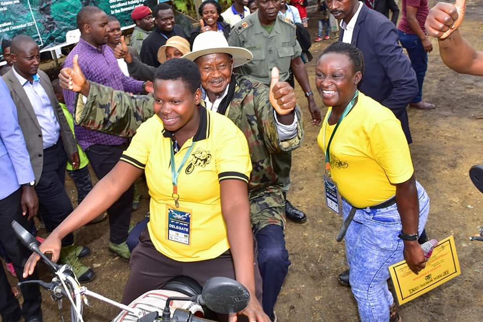 President Yoweri Museveni rides on a motorbike in one of his previous community outreach campaigns.