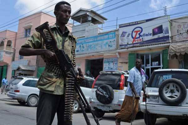 Somali federal government forces patrol a street of Mogadishu on February 18, 2015. The UN Security Council will travel to Somalia this month to show support for elections scheduled in August.
