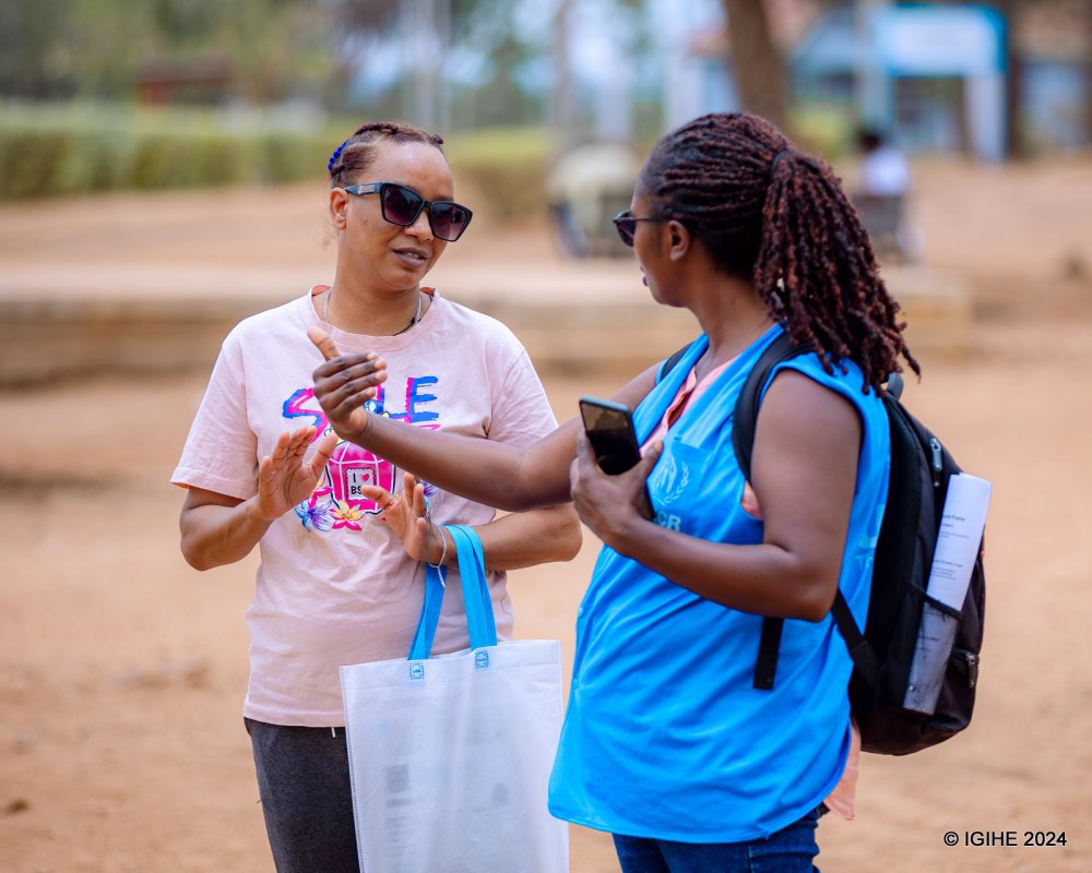 Dris Yourdanous Aforke speaking with one of the UNHCR staff members.