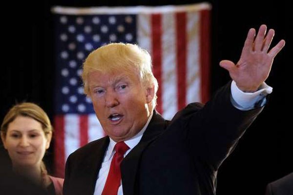 US Republican presidential candidate Donald Trump waves after a press conference at the Trump Tower on May 31, 2016 in New York.