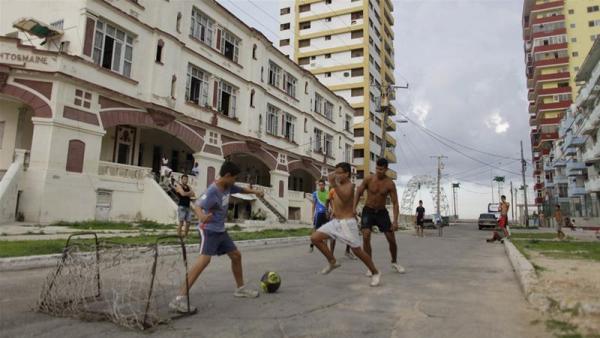 In this 2011 photo, children play football in front of the 'Maine' building in Havana