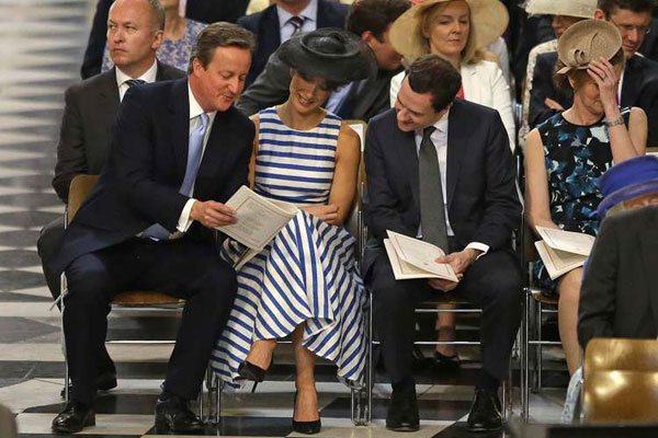 Britain’s Prime Minister David Cameron (left) and his wife Samantha and British Chancellor of the Exchequer George Osborne take their seats for a national service of thanksgiving for the 90th birthday of Queen Elizabeth II at St Paul’s Cathedral in London