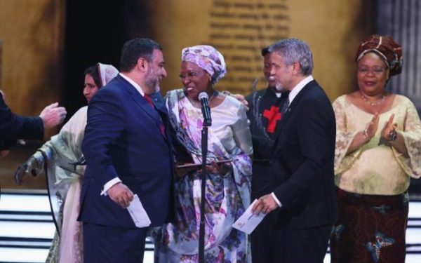 Marguerite Barankitse accepts her prize from George Clooney and Ruben Vardanyen, co-founder of the prize