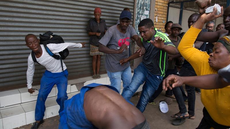 A Nigerian migrant comes under attack outside a church in Pretoria on Saturday