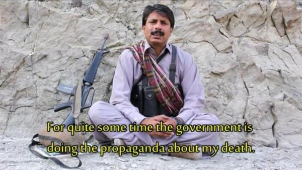 Nazar appeared in the video sitting next to an automatic rifle and wearing an ammunition belt [Vimeo screen shot]