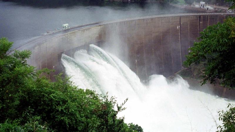 The Kariba Dam wall on the Zambezi river is seen with three flood gates open, in Karibe, Zimbabwe