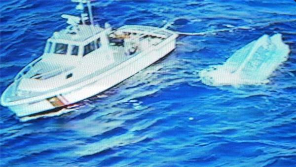 TV screen grab of US Coast Guard and boat used to take Cubans to the US.