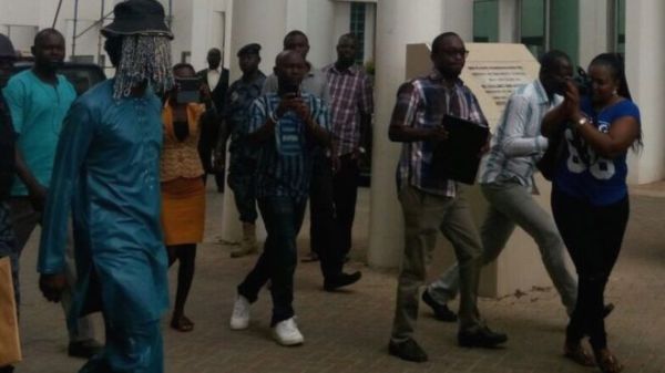 Journalist Anas Aremeyaw Anas (L), who hides his identity, went undercover to film