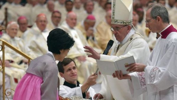 A vigil service included a papal baptism for 12 adults hailing from China, South Korea and other countries around the world.