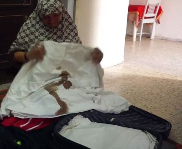 Sayeda Seifi has kept the blood-stained sheet her son's body was wrapped in on the day he died