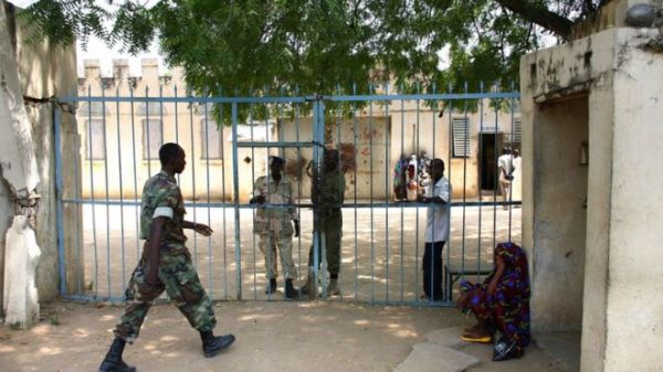 Chadian gendarmes stand guard at one of the gates of the jail in N'Djamena