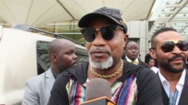 The musician joked with the media after the apparent fight at the airport