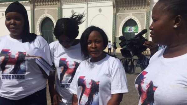 Protesters wore T-shirts with a French slogan reading "Let's save Mbayang"