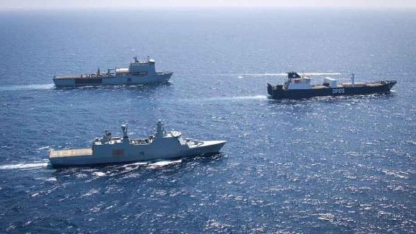 The Danish vessel (R) is transporting the last known materials believed to pose a chemical threat