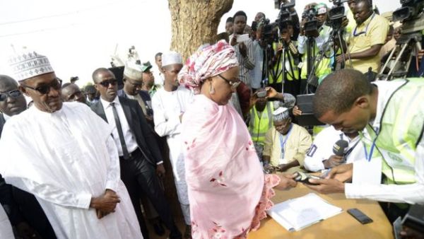 President Buhari (L) may not be able to rely on Mrs Buhari's (C) support if he chooses to run again in 2019