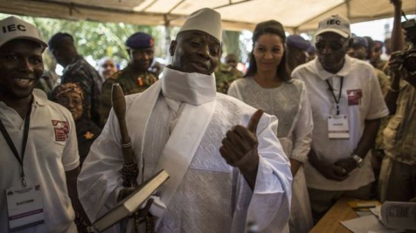 Incumbent Gambian President Yahya Jammeh gesturing at a Banjul polling station on election day