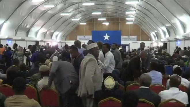 The aircraft hangar is crowded with MPs ready to vote