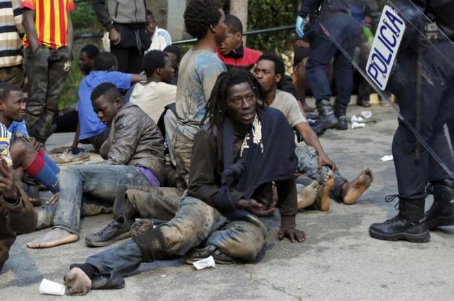 Both migrants and police were reportedly hurt when a group stormed the fence ringing Ceuta