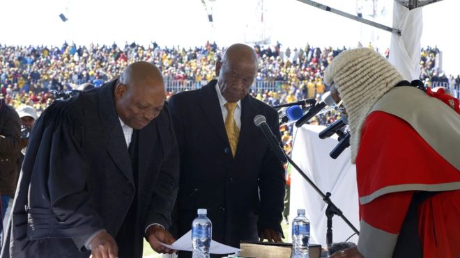 Prime Minister Thomas Thabane (L) was sworn in for a second time