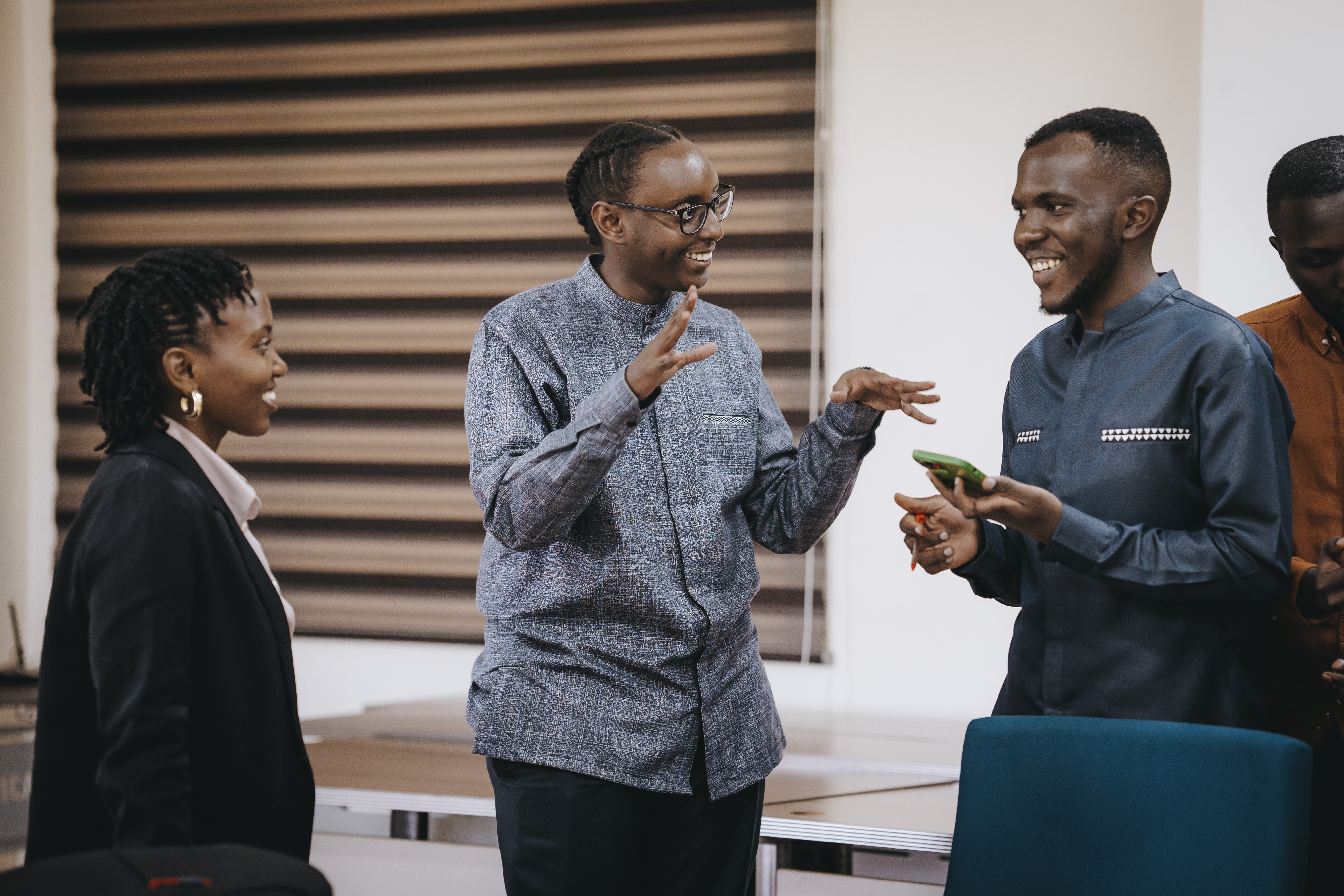 Representatives from PWC Rwanda engage Sauvé Jean-Luc, the co-founder and CEO of Strettch, after the presentation.