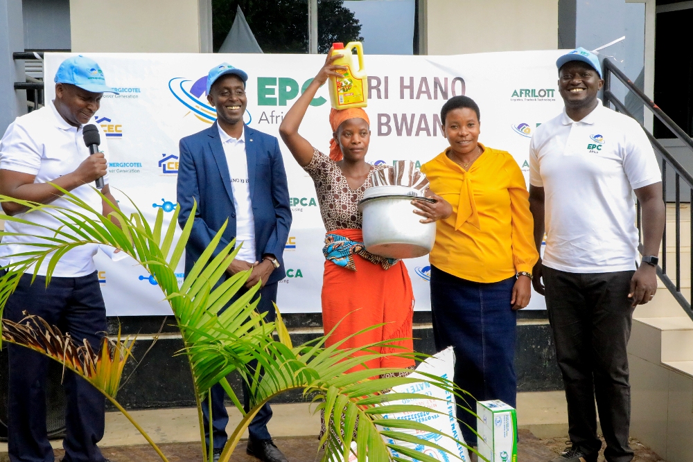 One of beneficiaries with local leaders and EPC Africa management after donating foodstuffs, kitchen utensils and cooking oil. 