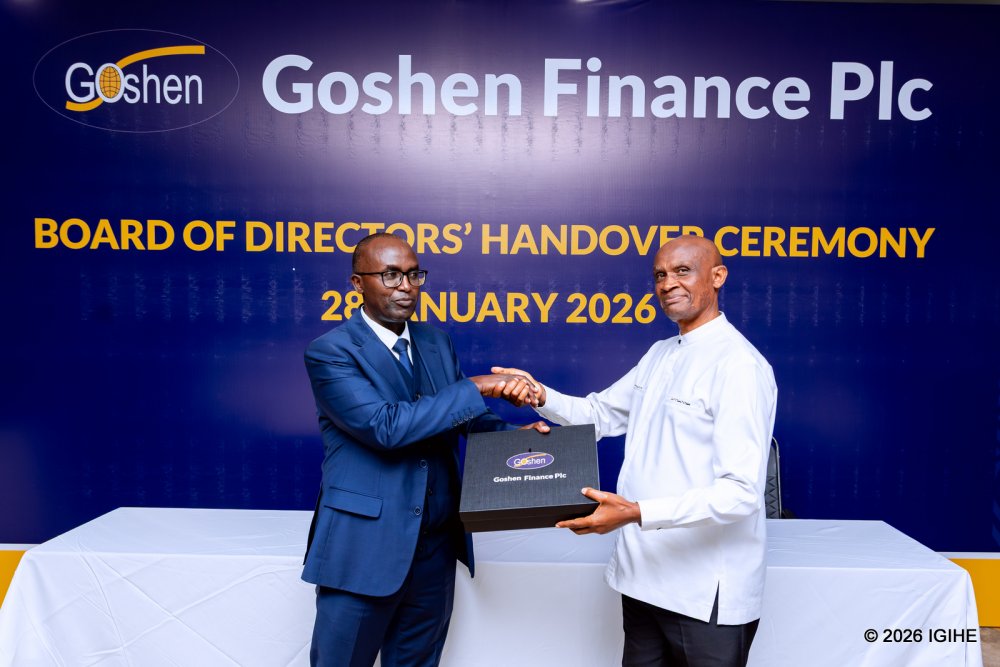 Peter Nkubara (right) hands over leadership to Gatera Jonathan, his successor as Chairperson of the Board of Directors of Goshen Finance PLC.
