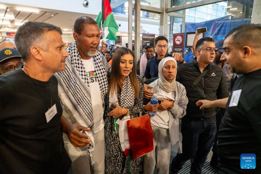 Mandla Mandela (2nd L, front), grandson of late former President Nelson Mandela, and his wife leave after a press conference at OR Tambo International Airport in Johannesburg, South Africa, Oct. 8, 2025.