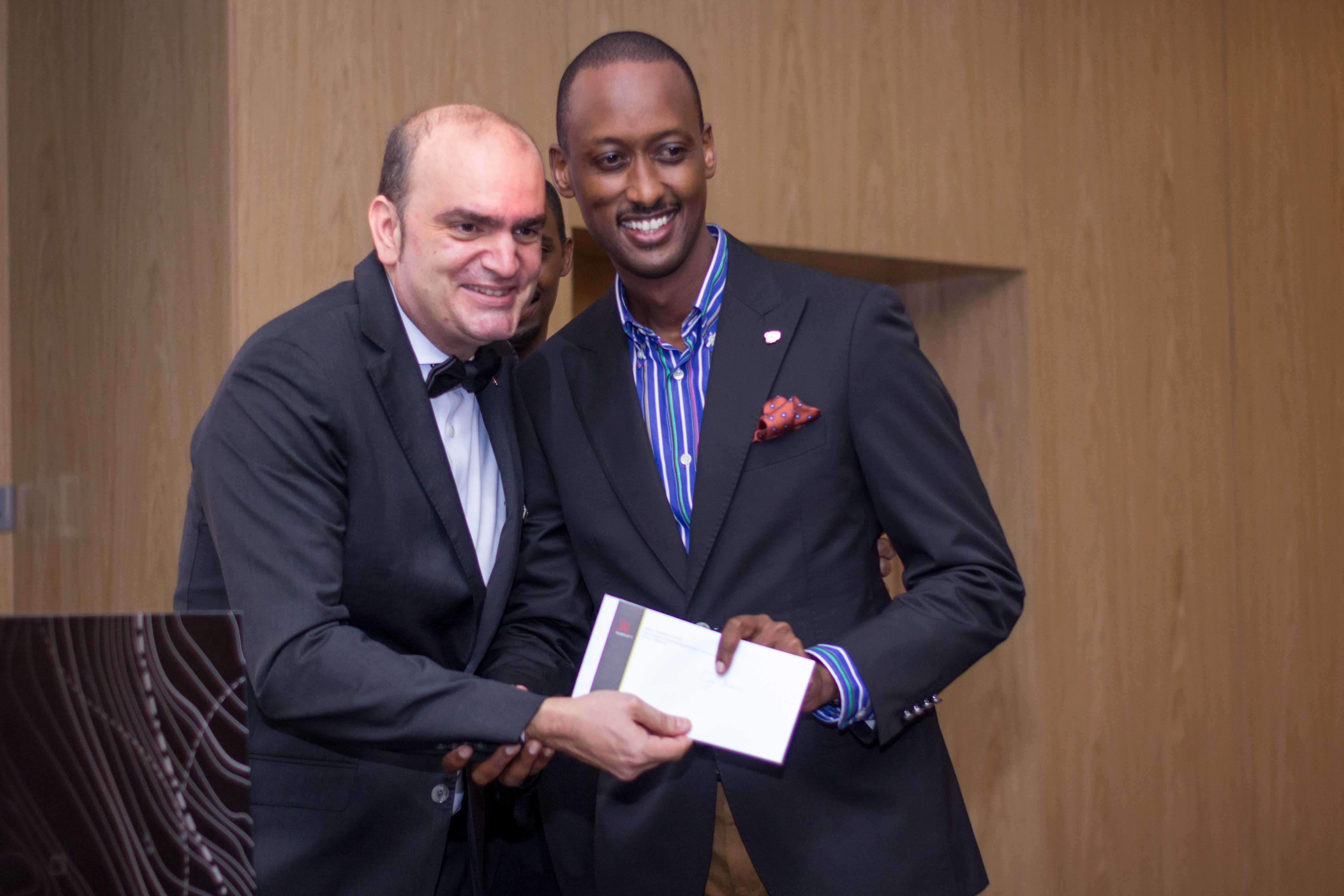 A delighted guest receives his prize from the director of Sales & Marketing, Pablo Alonso