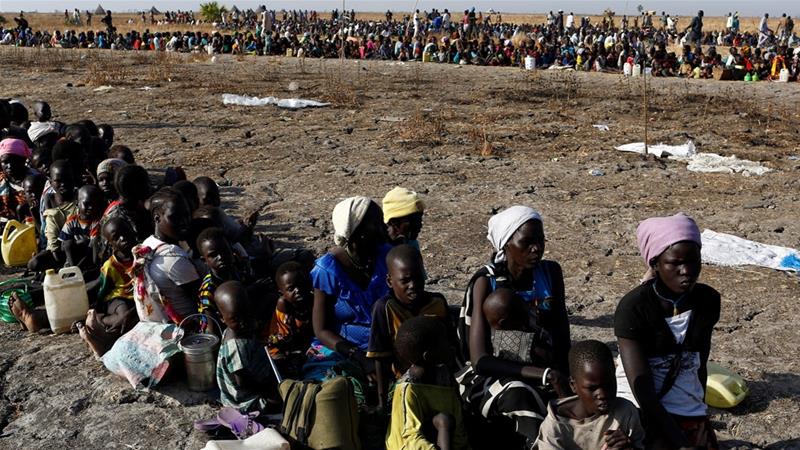 Women and children wait to be registered prior to a UN food distribution