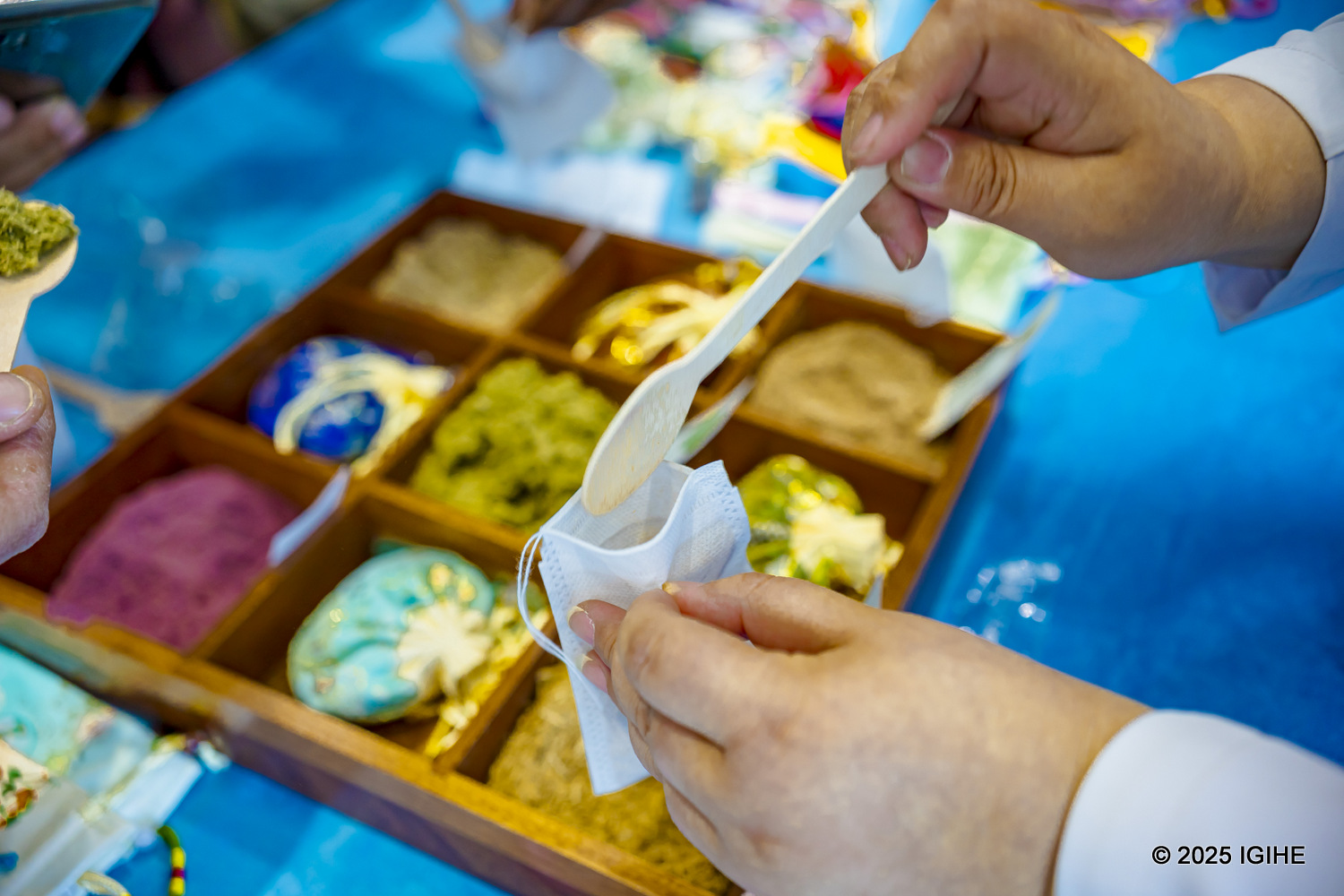 A doctor carefully measures and sorts dried herbs to create the perfect blend for each patient’s prescription.