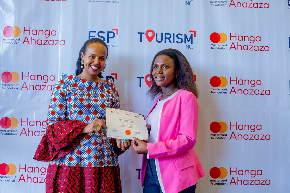 One of graduates in the fourth cohort receiving a certificate.