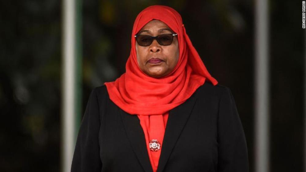 Tanzanian President Samia Suluhu Hassan inspects a military parade following her swearing in as the country's first female president Friday in Dar es Salaam, Tanzania.