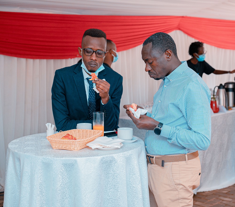 Participants of the event tasting bread and confections produced by Bourbon Coffee.  