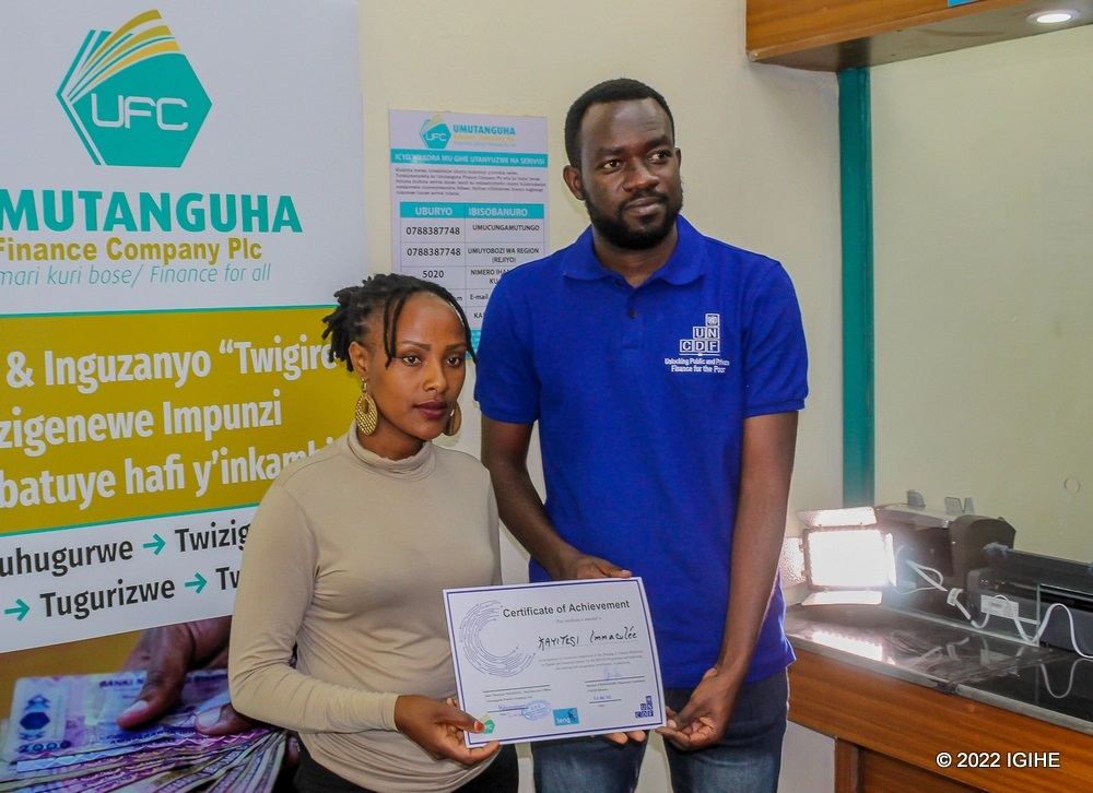 One of trainees (left) receiving a certificate of completion.  