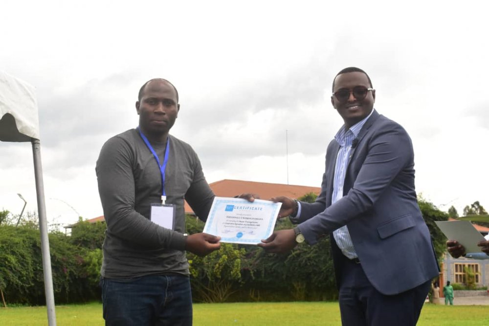 One of graduates receiving certificate of completion. 