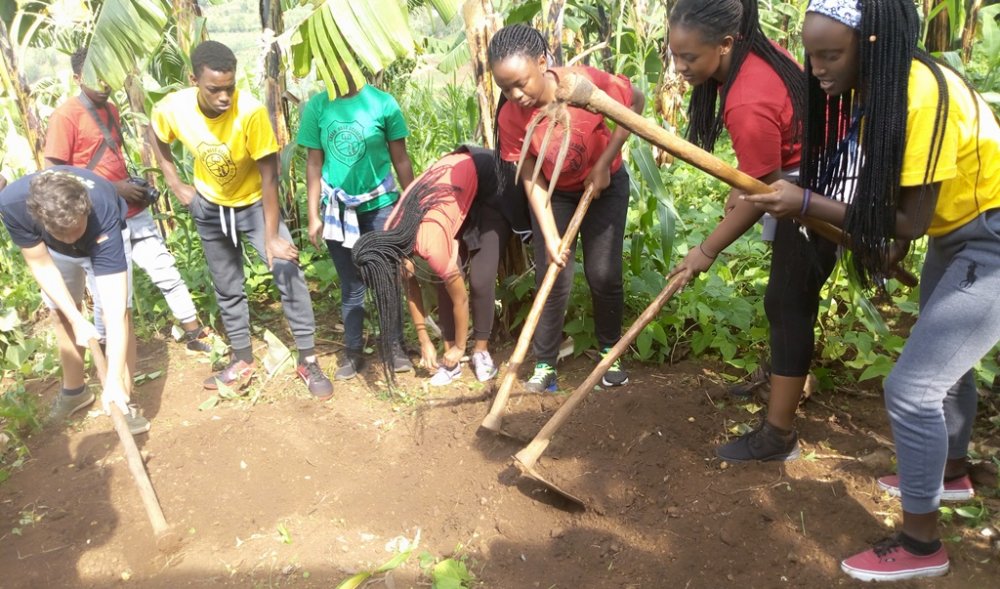 Students from S5 and S6 at Green Hills Academy have joined residents in doing Umuganda and paid for health insurance for 150 people living with disabilities