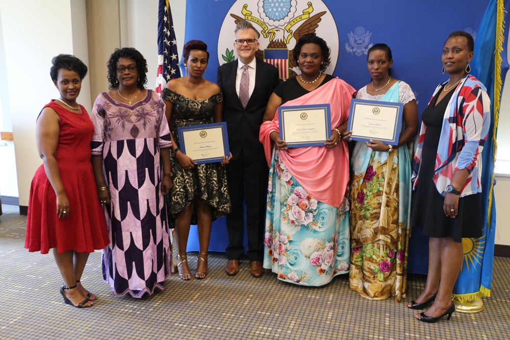 Awardees pose for a photo with U.S. Chargé d'Affaires, Richard Michaels