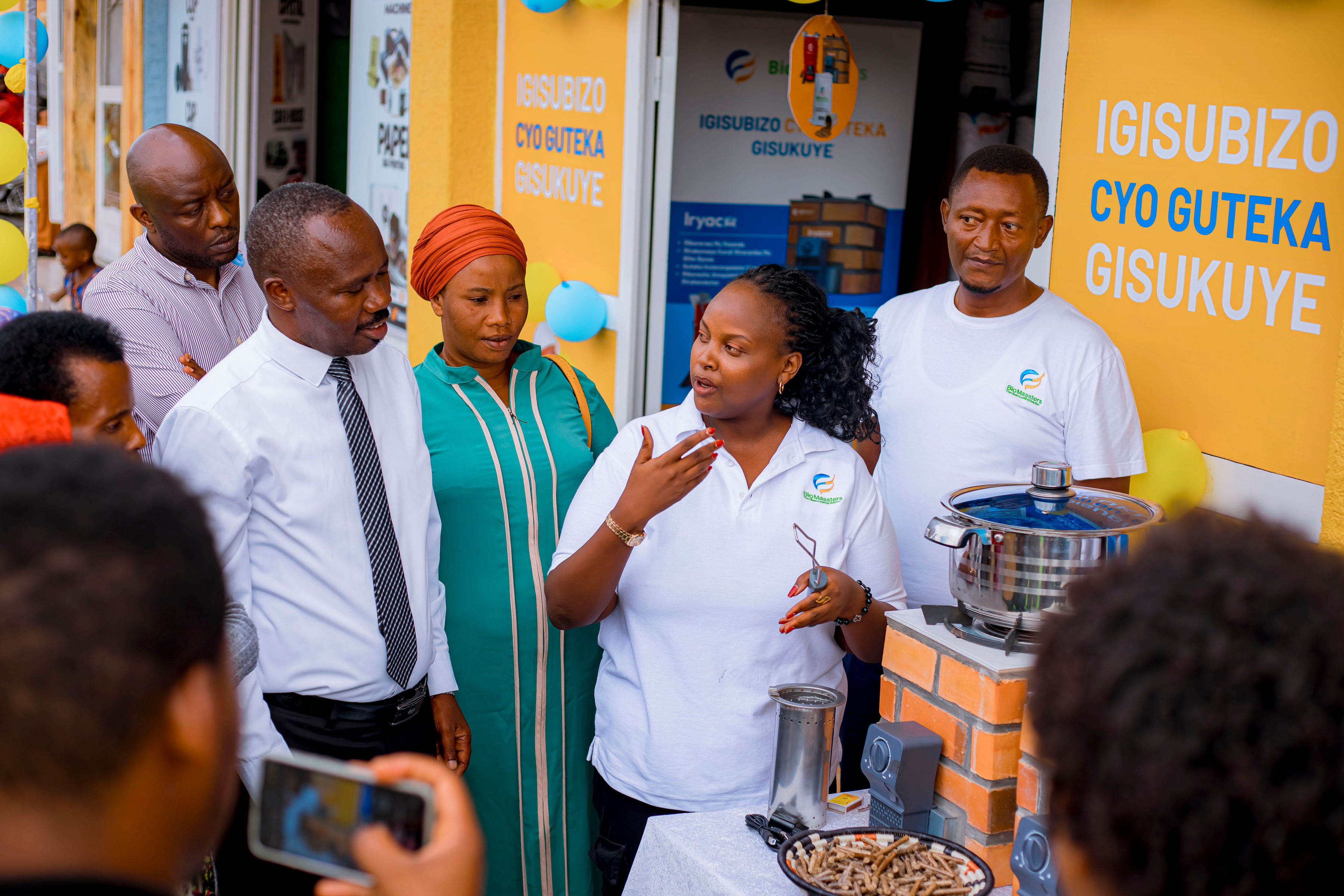 BioMassters employees demonstrate the operation of their stoves.